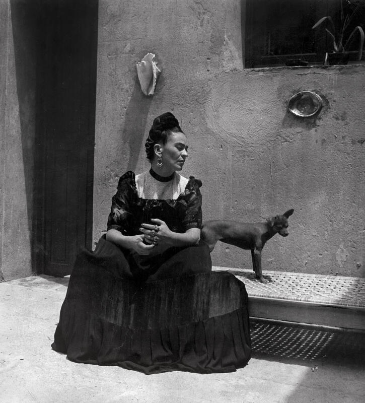 Frida Kahlo and a very cute dog